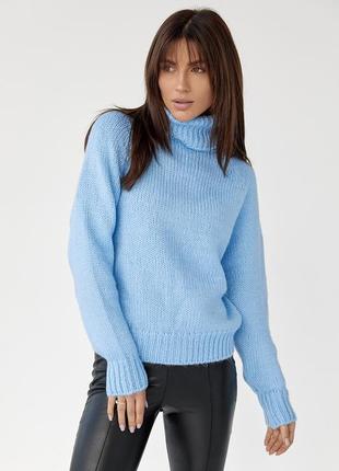 Жіночий в'язаний светр oversize з рукавами-регланами.