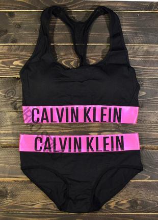 Женский комплект нижнего белья calvin klein (топ + слипы) коллекция intense, цвет черный c розовой резинкой1 фото