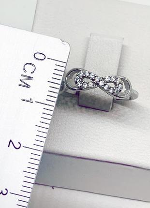 Кольцо серебряное с кубическим цирконием "бесконечность" 17 1,57 г4 фото
