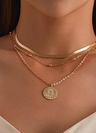 Многослойное ожерелье-цепочка с подвеской золотого солнца