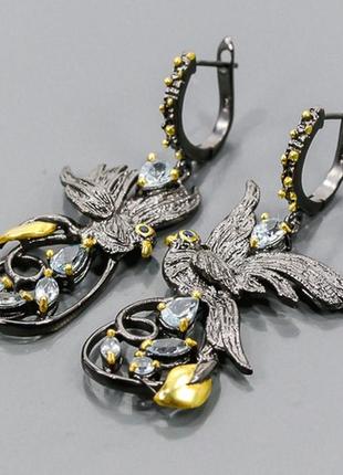 Набор серебряных украшений ручной работы с натуральными небесно-голубыми топазами3 фото