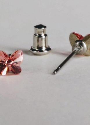 Сережки xuping з кристалами сваровські метелики колір рожевий d-5мм родій