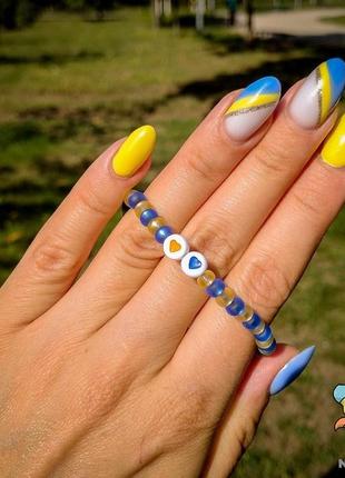 Браслет жовто блакитні серця.  ручна робота. авторський дизайн1 фото