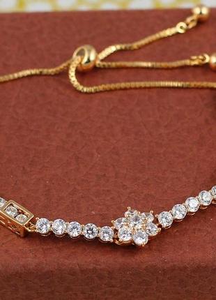 Браслет xuping jewelry вагончики з камінців і квіткою по центру на бігунці, що регулюється золотистий