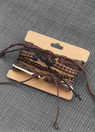 Набор кожаных браслетов крест коричневые на завязках4 фото