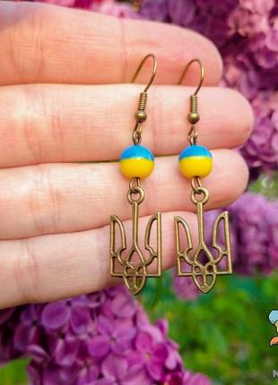 Сережки "герб україни 23*12 мм. жовто блакитні намистини". колір бронза