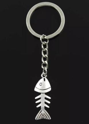 Брелок металлический для ключей, сумок, рюкзаков "скелет рыбки" серебристый1 фото