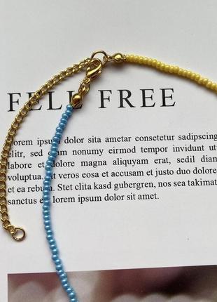 Ожерелье на шею желто-голубое c жемчужиной и золотистой фурнитурой2 фото