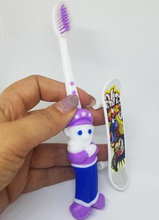 Детская зубная щетка с  игрушкой- скейтборд на колесиках1 фото
