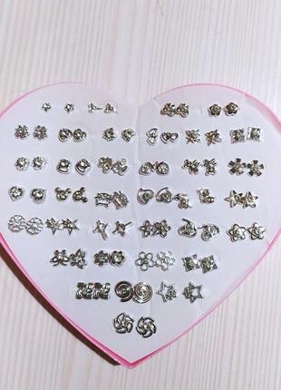 Сережки - гвоздики в наборі 36 пар з білими кристалами в срібному кольорі2 фото