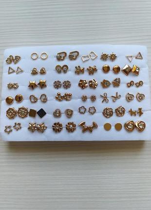 Стильные серёжки -гвоздики набор из 36 пар разных форм в золотом цвете1 фото