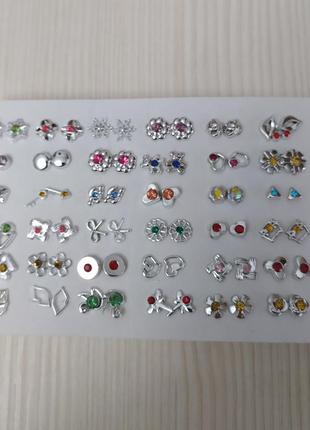 Сережки - гвоздики в наборі 36 пар в срібному кольорі4 фото