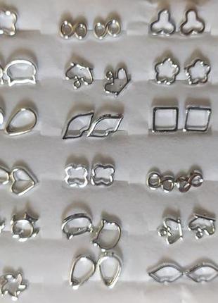 Елегантні сережки - гвоздики в наборі 36 пар в срібному кольорі3 фото