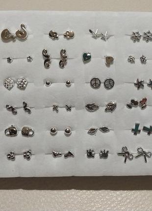 Сережки -гвоздики набір з 36 пар в срібному кольорі2 фото