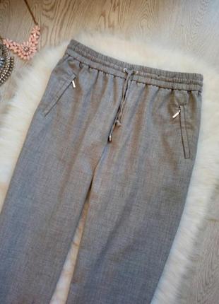 Серые плотные штаны брюки джоггеры на резинке карманами на молнии с подворотами f&f2 фото