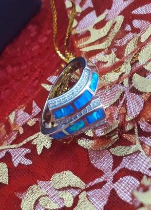 Что подарить серебряное кольцо с камнем голубой опал женское1 фото