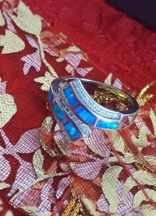 Что подарить серебряное кольцо с камнем голубой опал женское7 фото