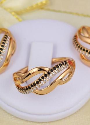 Кольцо xuping jewelry  с черными и белыми мелкими фианитами р 18  золотистое1 фото