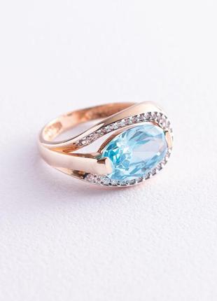 Золотое кольцо (фианиты, голубой топаз) 
к05442