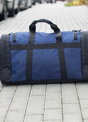Дорожня спортивна сумка пума puma biz синя чорна тканинна для тренувань та подорожей на 60 л2 фото