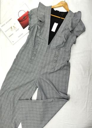 Комбінезон брючний з щільної тканини з декольте рюшами сірий білий curver knit6 фото