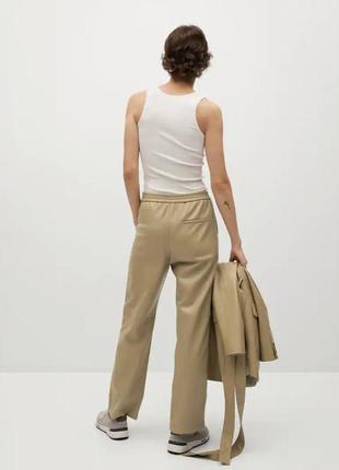 Прямые свободные кожаные  светлые бежевые штаны брюки2 фото