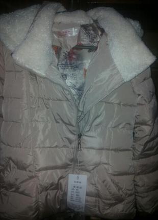Новий пуховик.колір -пудра р-р 46-48