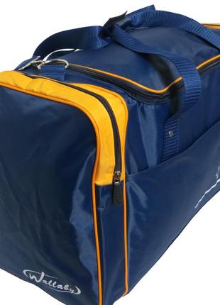 Стильна яскрава якісна синьо-жовта дорожня сумка унісекс1 фото