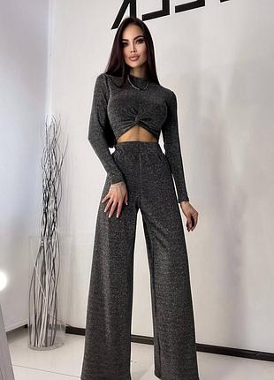 ❤️сногсшибательный костюм серого цвета из люрикса, в комплекте- топик, брюки, юбка. размер: 42-44