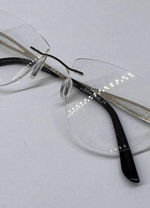 Жіночі коригуючі окуляри трикутні безоправні8 фото