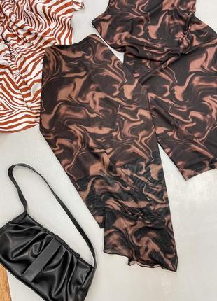 Спідниця міді із сіточки в принт