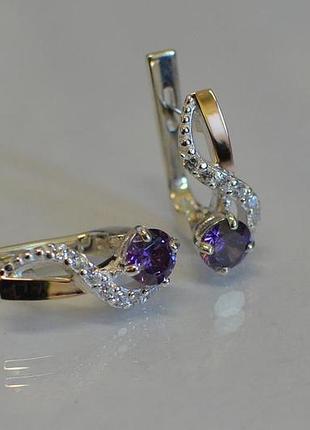 Срібні сережки з золотими вставками