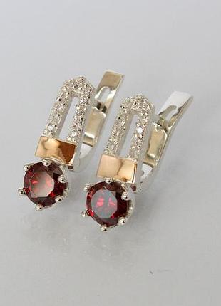 Срібні сережки з золотими вставками