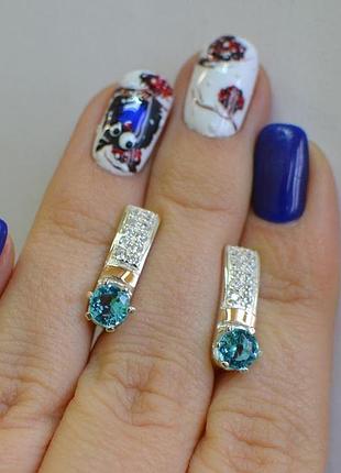 Срібні сережки з золотими вставками