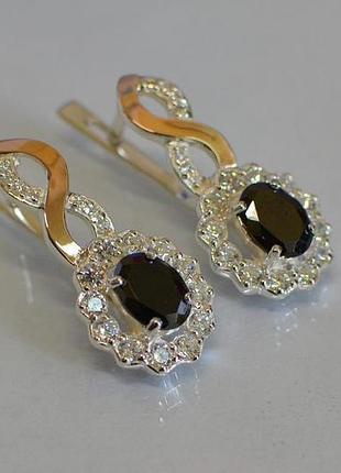 Срібні сережки з золотими вставками