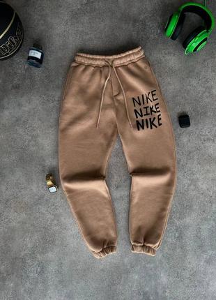 Чоловічі коричневі спортивні штани nike6 фото