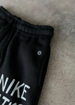 Чоловічі теплі чорні спортивні штани nike6 фото