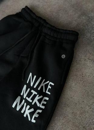 Чоловічі теплі чорні спортивні штани nike5 фото