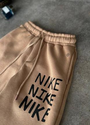 Чоловічі теплі спортивні штани nike8 фото