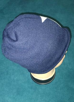 Синяя зимняя шапка со звездой action. нидерланды. размер-универсальный/57-60см.3 фото
