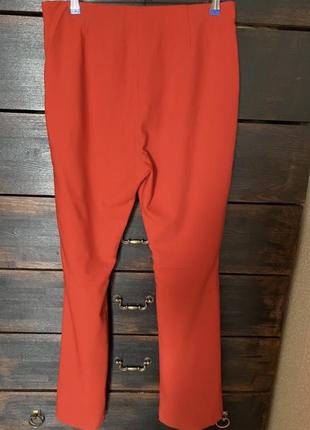 Новые классные стильные эффектные красные брюки на резинке снизу с разрезами 52-54 р2 фото