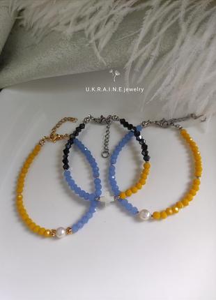 Жовто-блакитні патріотичні браслети з річковими перлами або перламутру3 фото