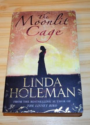 The moonlit cage by linda holeman, книга на  английском