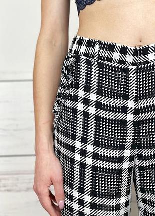 Легкі брюки в клітинку з рюшею по краю на високій посадці 1+1=34 фото