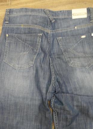 Голубые джинсы4 фото