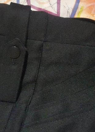 Чорна стрейчева спідниця з косими кішенями2 фото