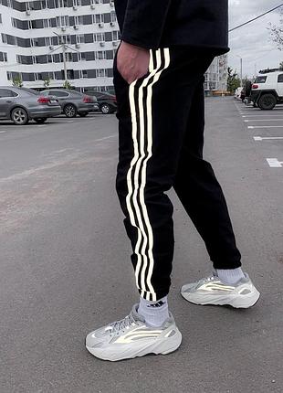 Чоловічі чорні з білими смужками теплі спортивні штани на флісі з гумками звужені споривки
