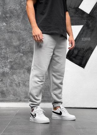 Чоловічі сірі теплі спортивні штани на флісі з гумками звужені споривки чудової якості2 фото