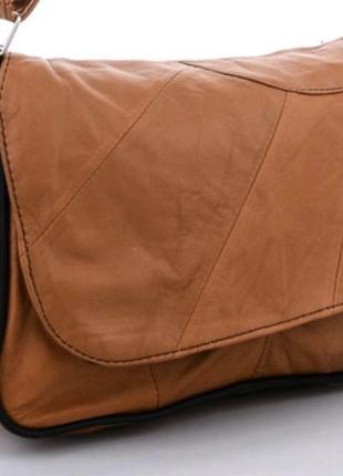 Женская небольшая вместительная кожаная сумка.1 фото