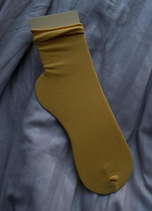 Капронові жіночі довгі шкарпетки жовтого кольору